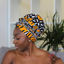 Load image into Gallery viewer, Easy headwrap - Satin lined hair bonnet - Orange / black Chioma
