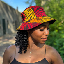Charger l&#39;image dans la galerie, Chapeau bob / Chapeau de pêcheur avec imprimé africain - Design de cercles concentriques rouges et jaunes - Tailles enfants et adultes (Unisexe)

